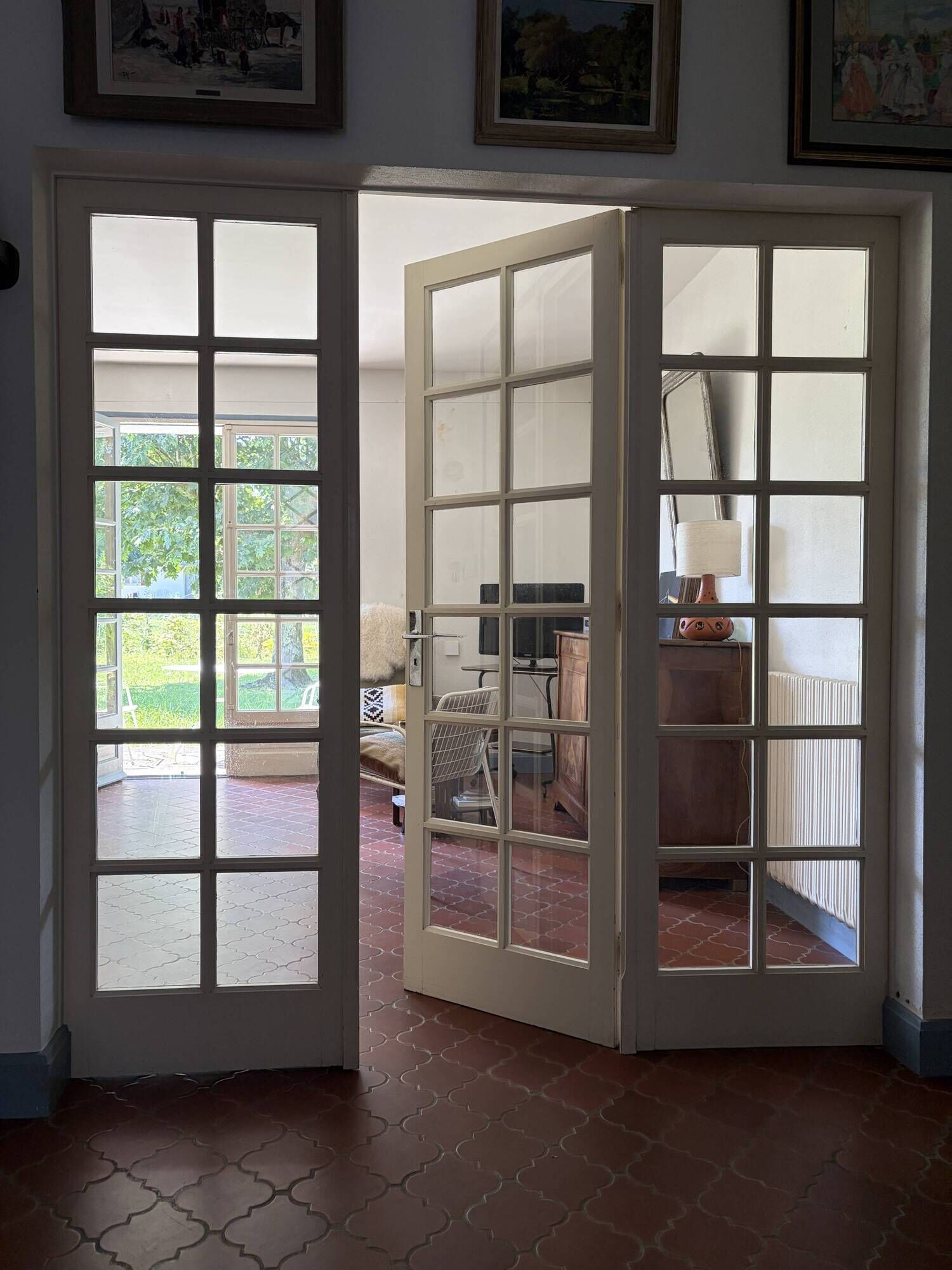Triptych glass door with three panels featuring small panes. Vintage.