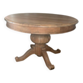 Round dining table in solid cherry wood.
