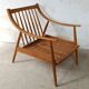 Pair of cozy teak armchairs with cushions