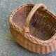 Round oval basket in rattan and woven wicker with handle