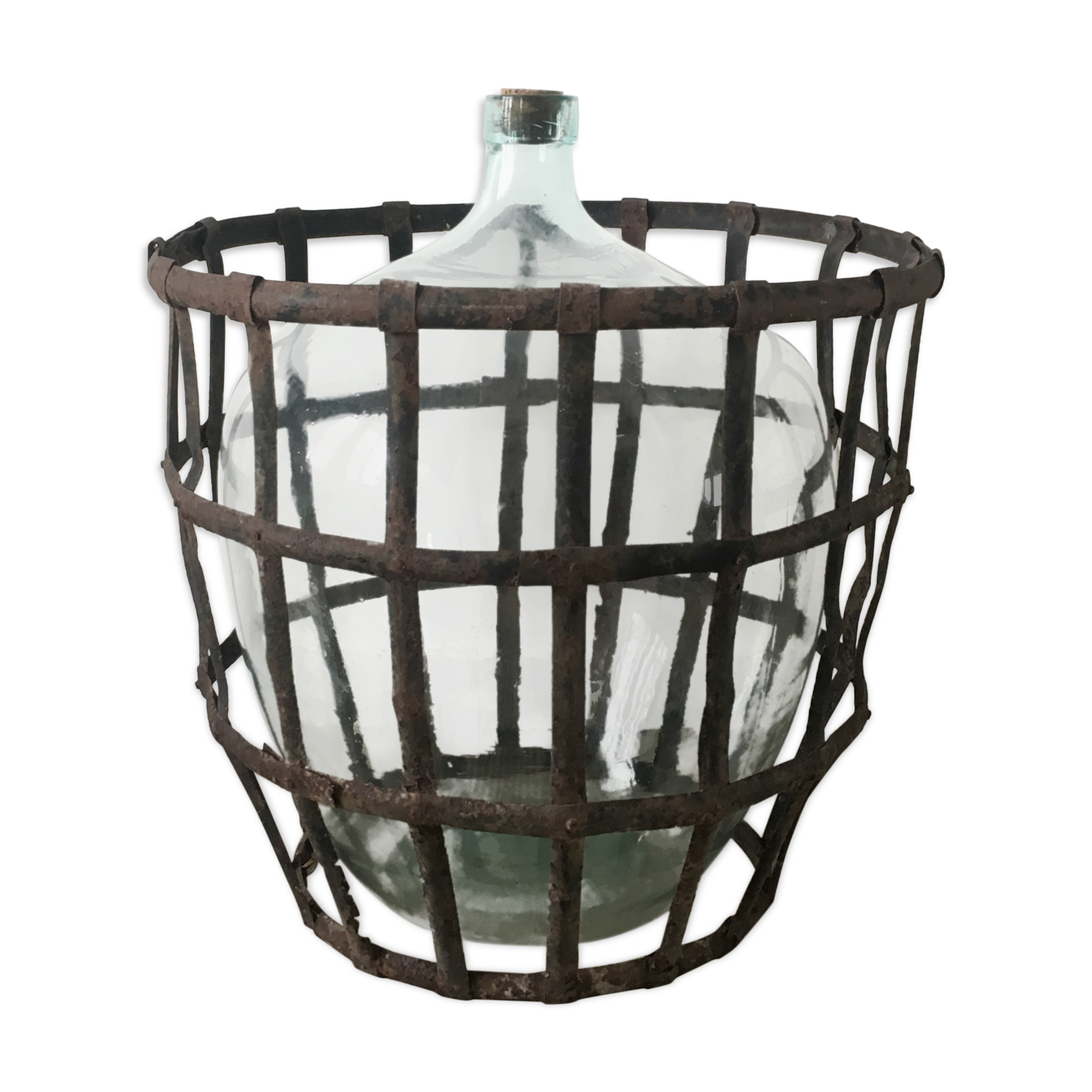 Old demijohn and her metal basket