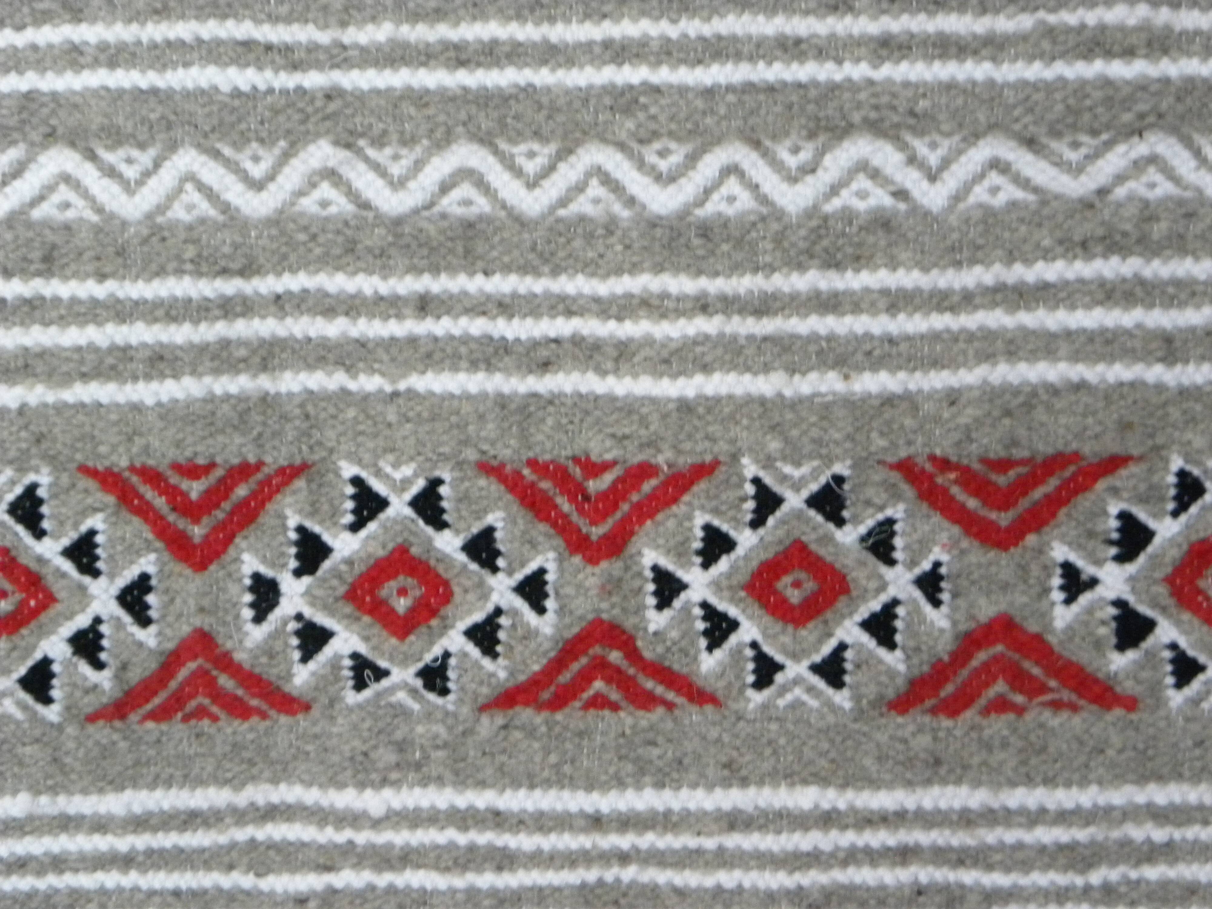 Geometric woven rug with fringes – Ethnic style – Hallway & interior