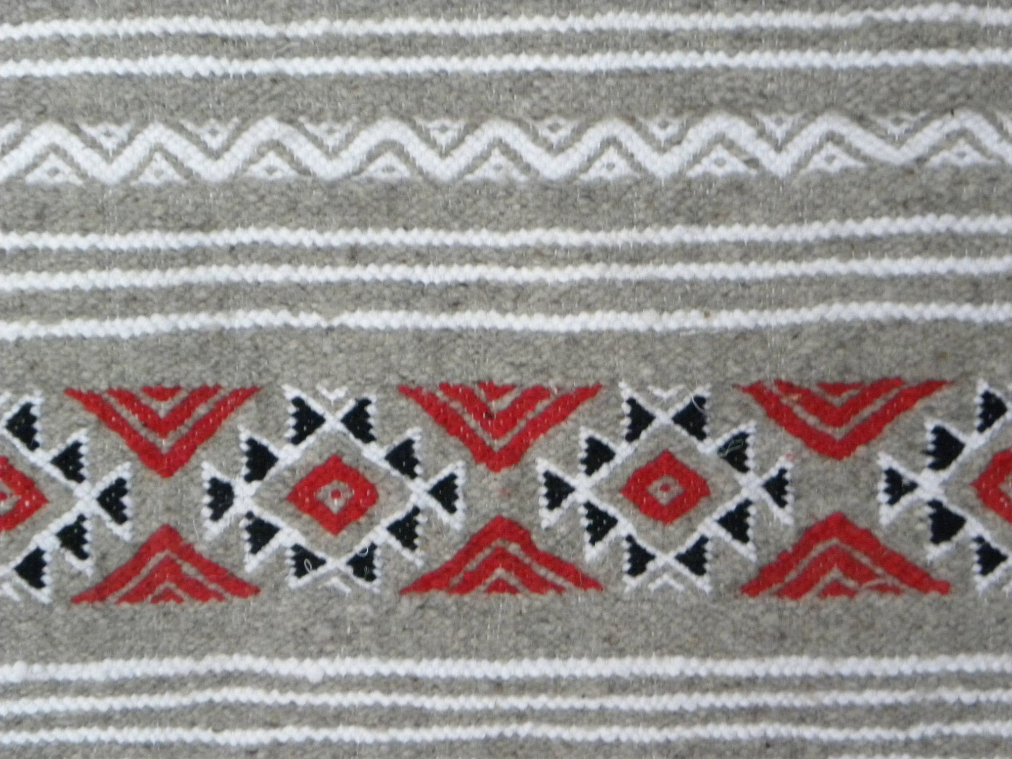 Geometric woven rug with fringes – Ethnic style – Hallway & interior