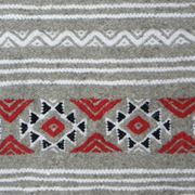 Geometric woven rug with fringes – Ethnic style – Hallway & interior