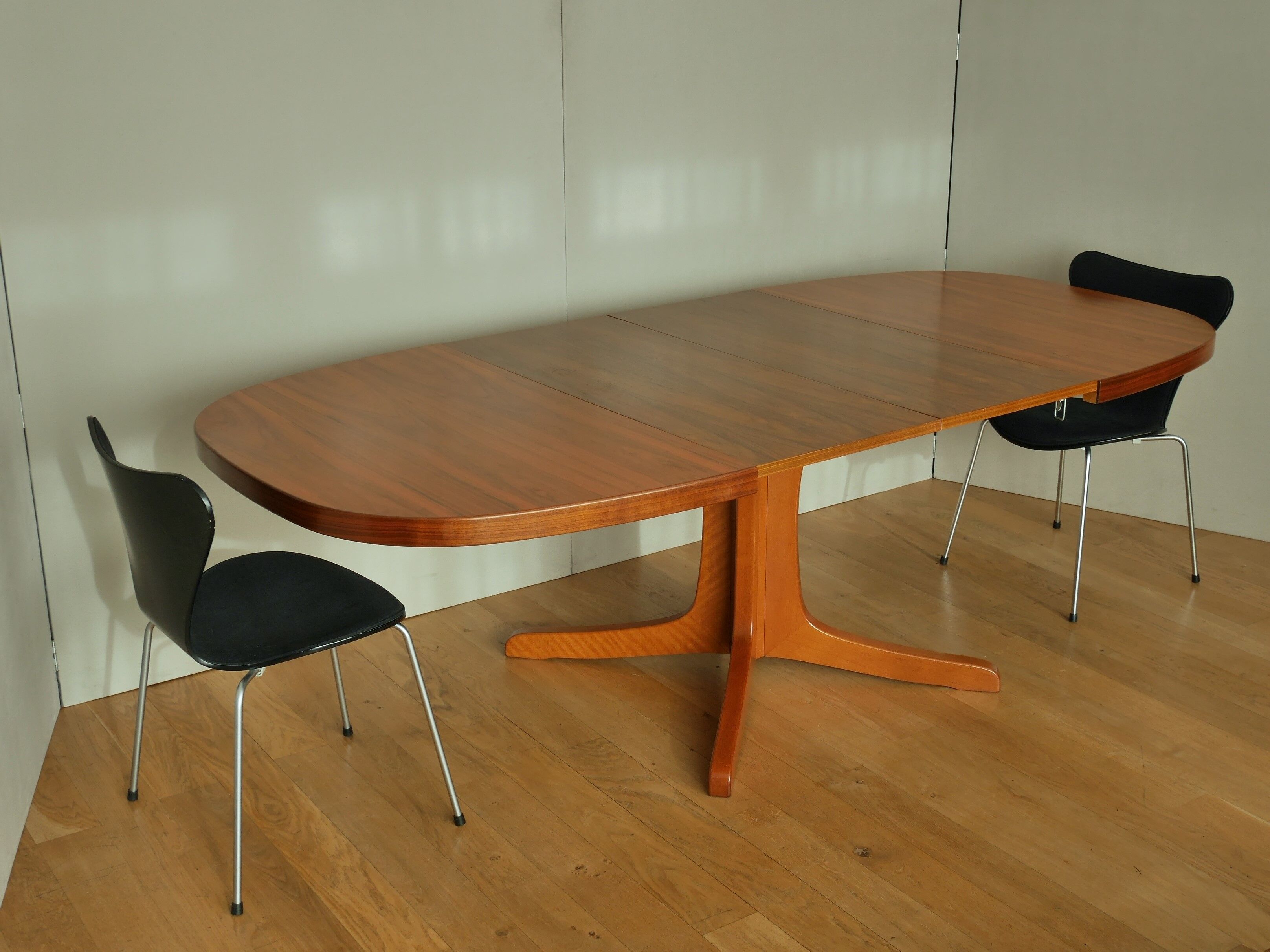 Oval walnut table with extension cords