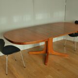 Oval walnut table with extension cords