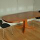 Oval walnut table with extension cords