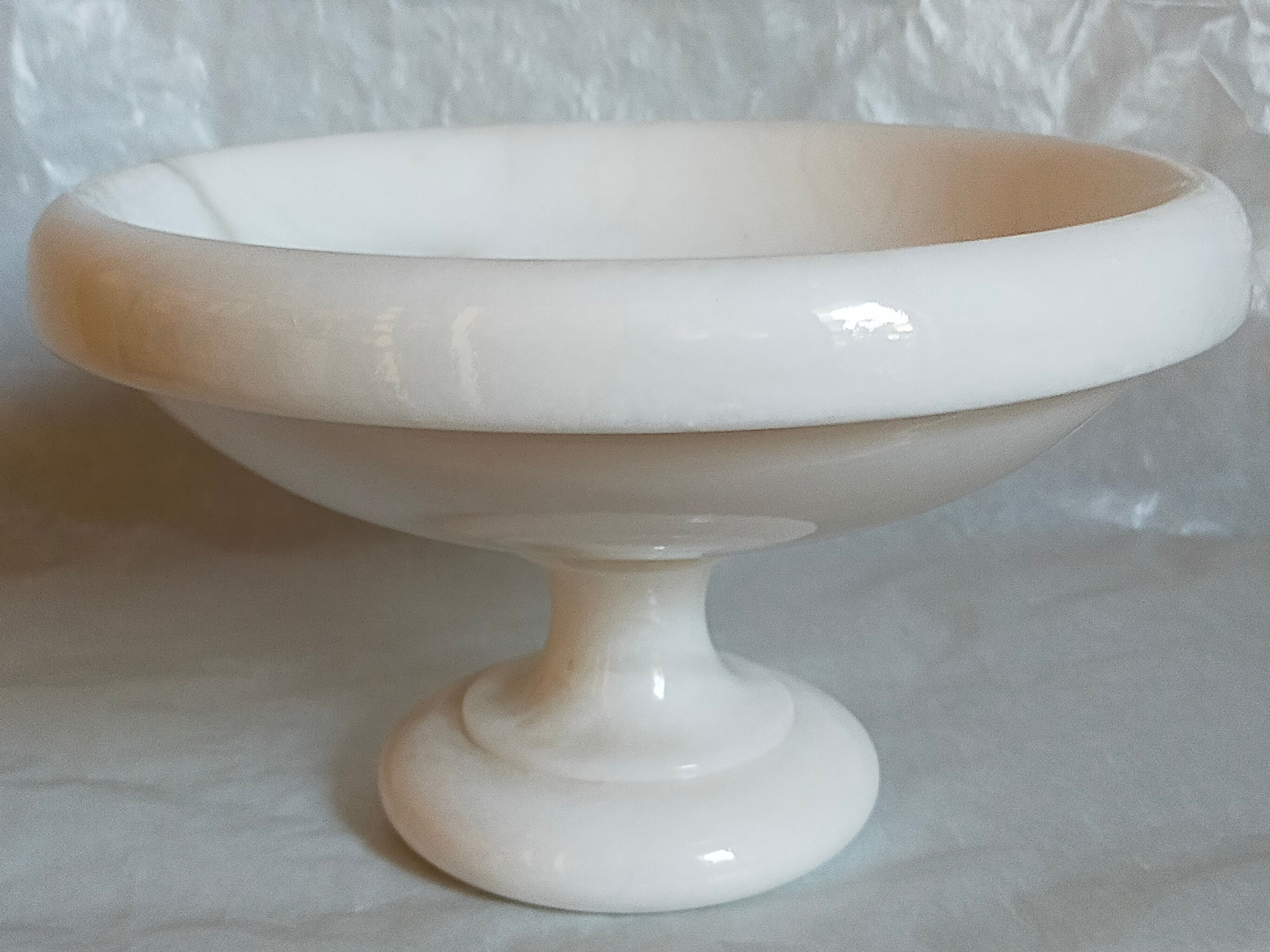 Standing cup in old white marble