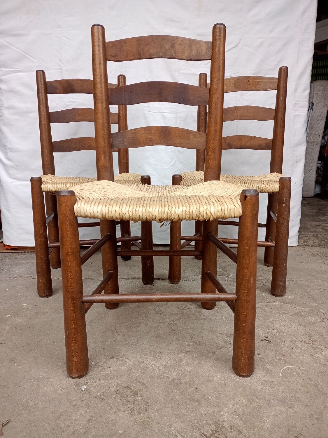 Brutalist chairs in walnut and straw