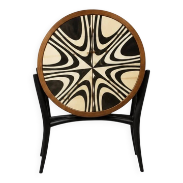 An Art Deco drum chest of drawers in beech wood with 6 black and beige drawers.