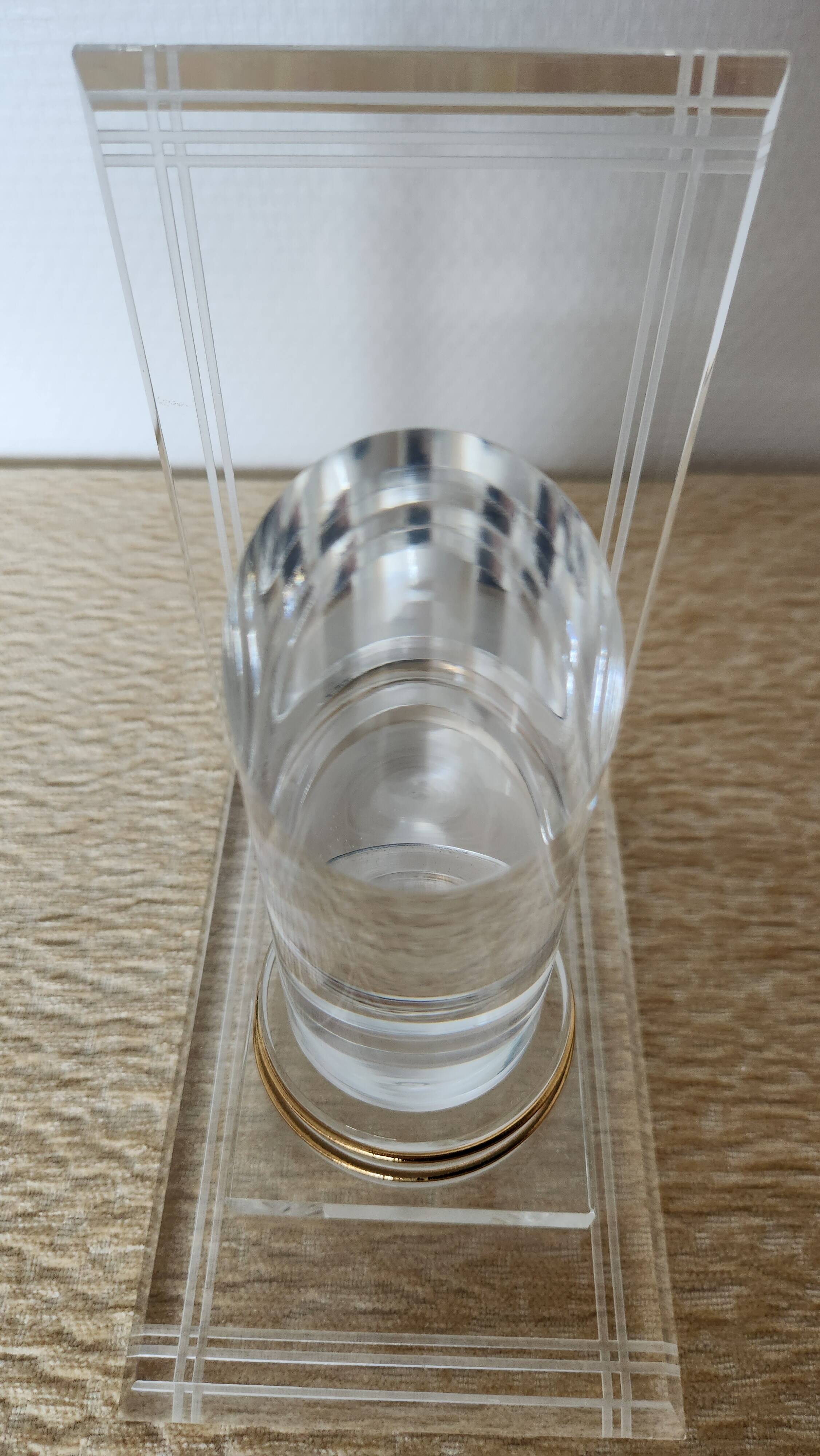 Pair of column bookends in plexiglass and gold metal, 1980s design.