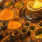 Sputnik wall lamp in brown and orange ceramic, Germany, 1970s.