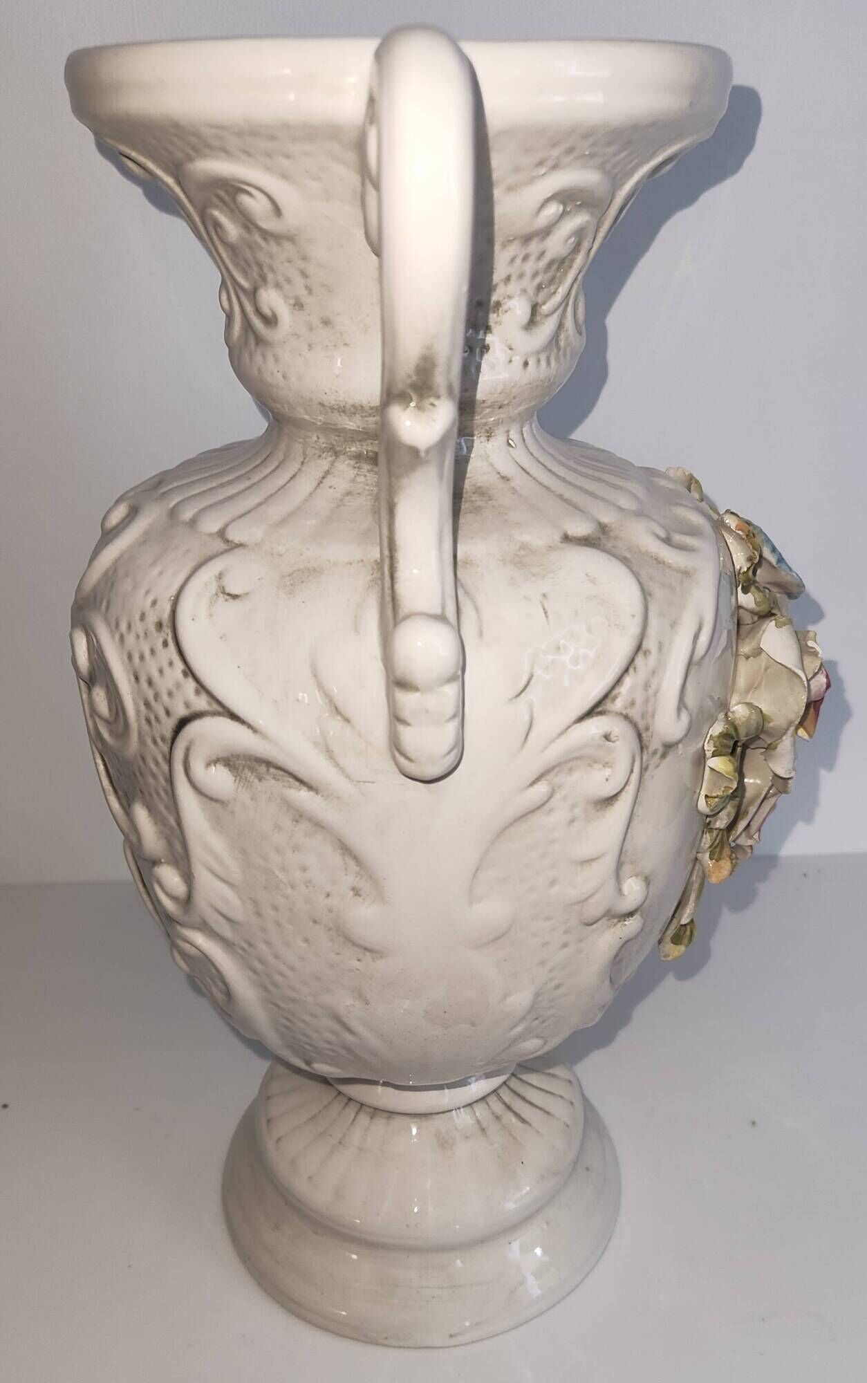 Vintage Italian white ceramic vase with raised floral decoration.