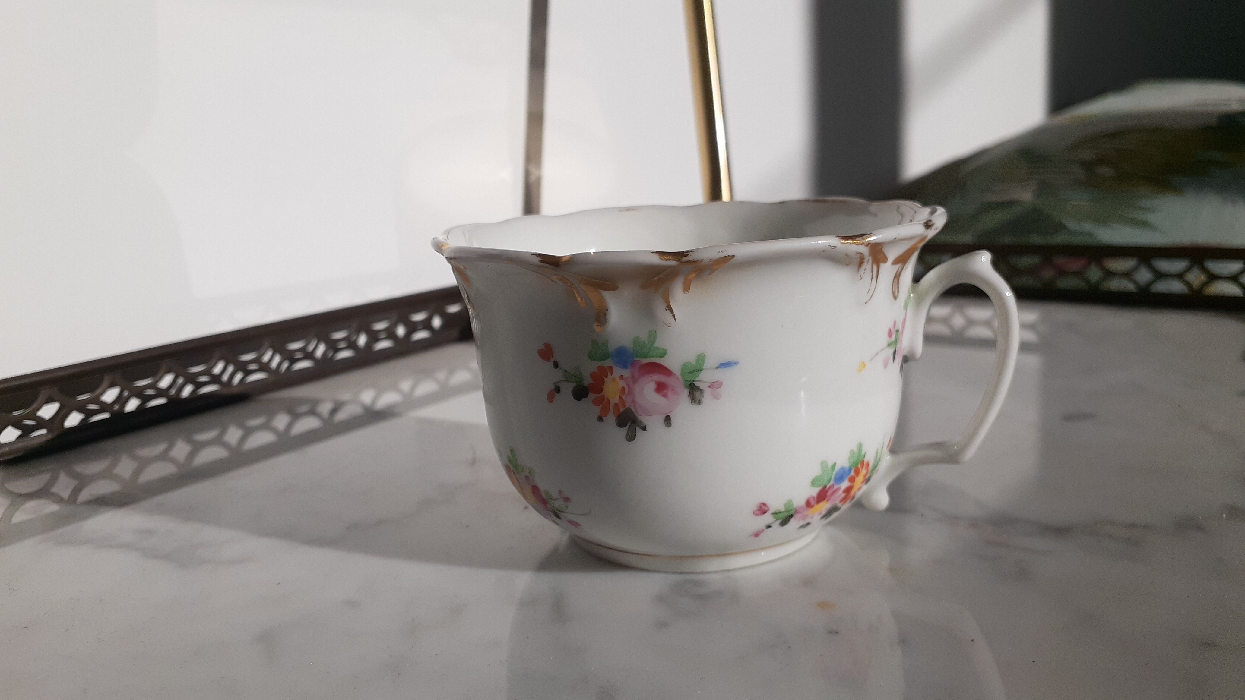 Antique flowered porcelain cup
