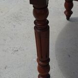 Round drop-leaf table made entirely of solid walnut