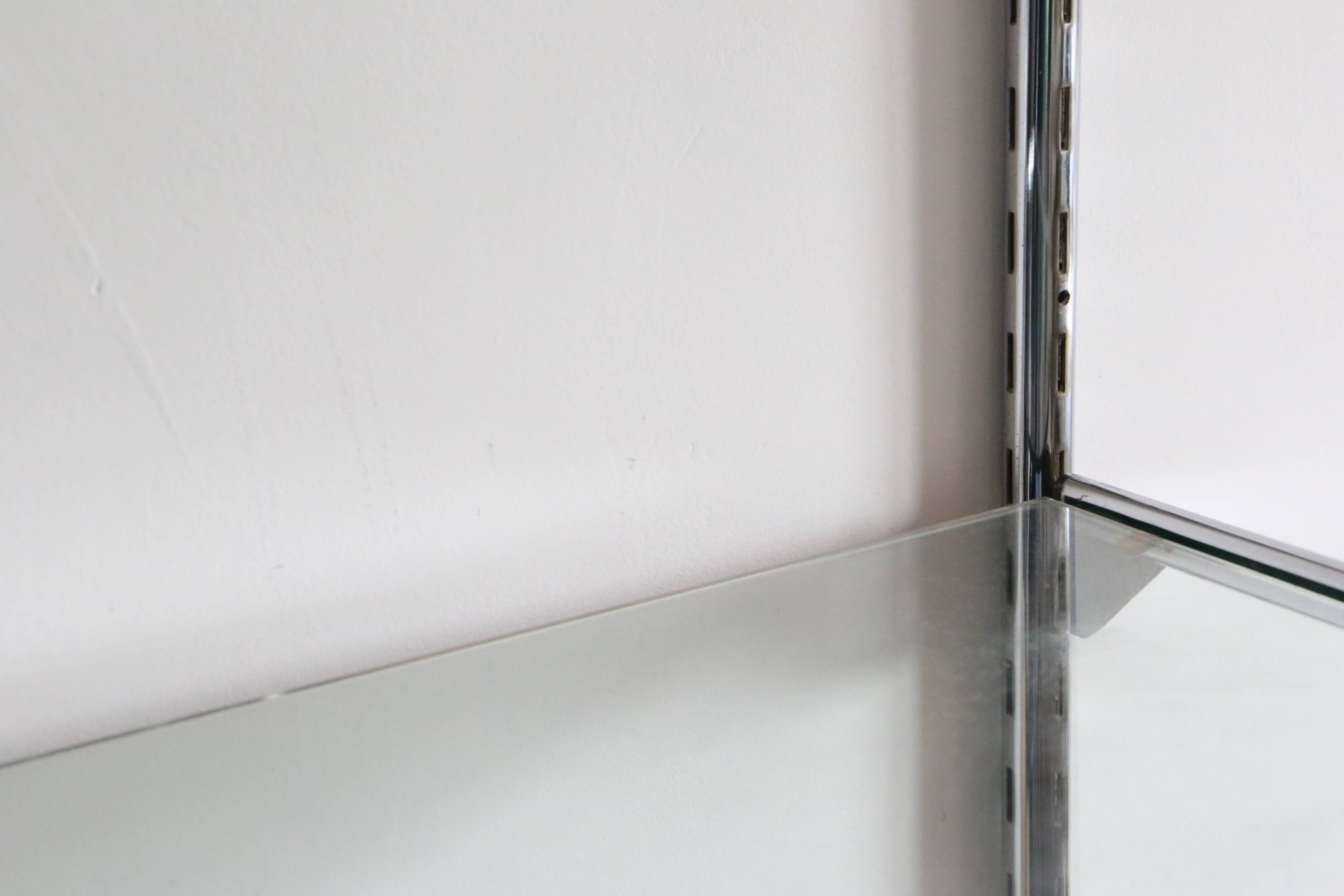 Chrome and glass wall shelf, circa 1960
