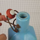 Bottle bottle in old enamelled sandstone