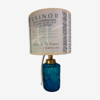 Table lamp with king blue and gold glass foot and machineinor action lampshade