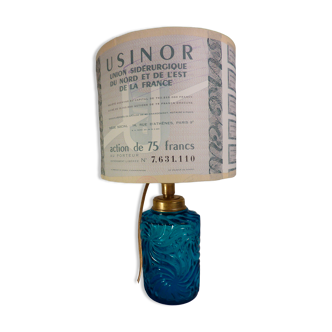 Table lamp with king blue and gold glass foot and machineinor action lampshade