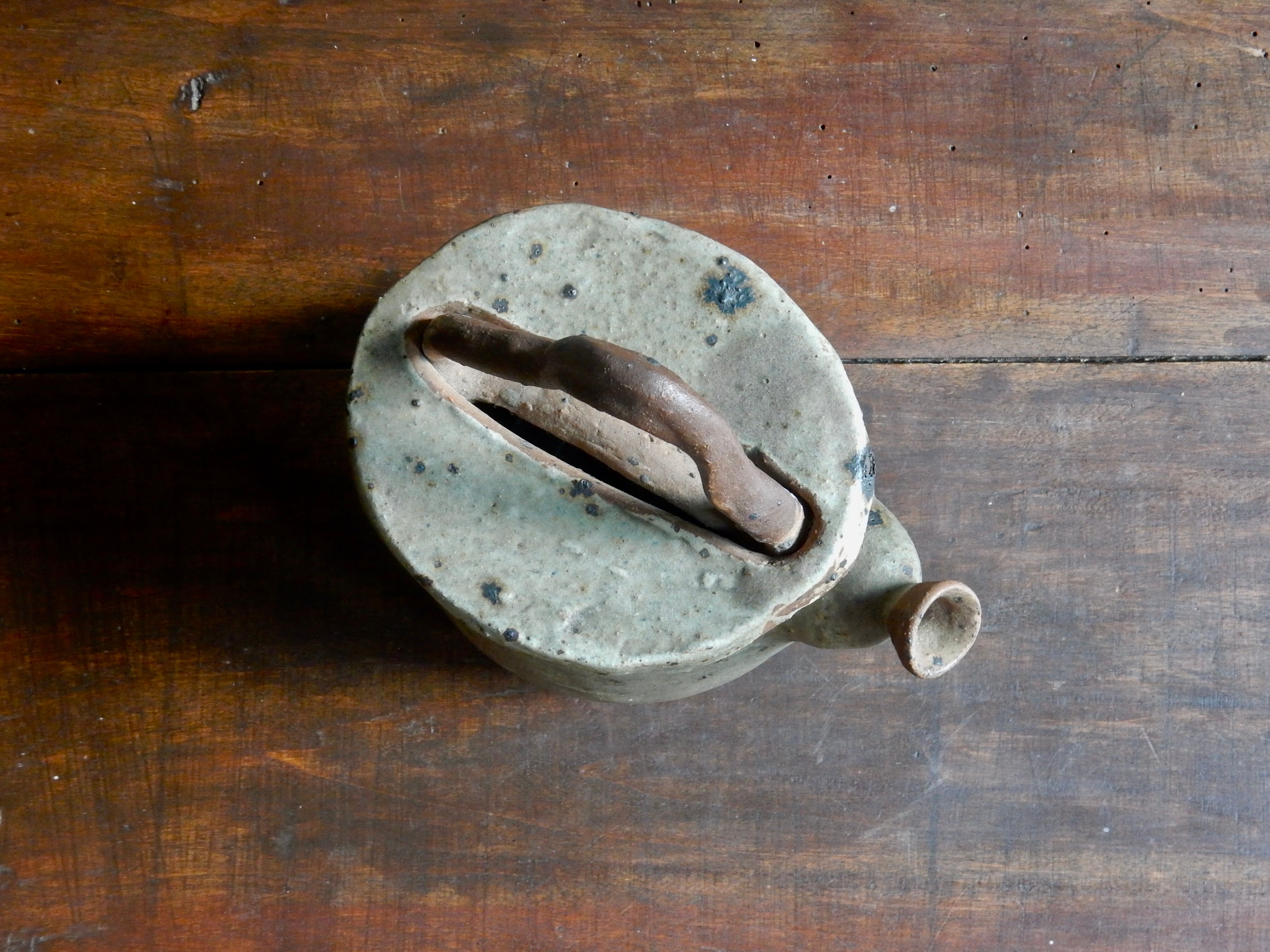 Homemade teapot in pyrity sandstone