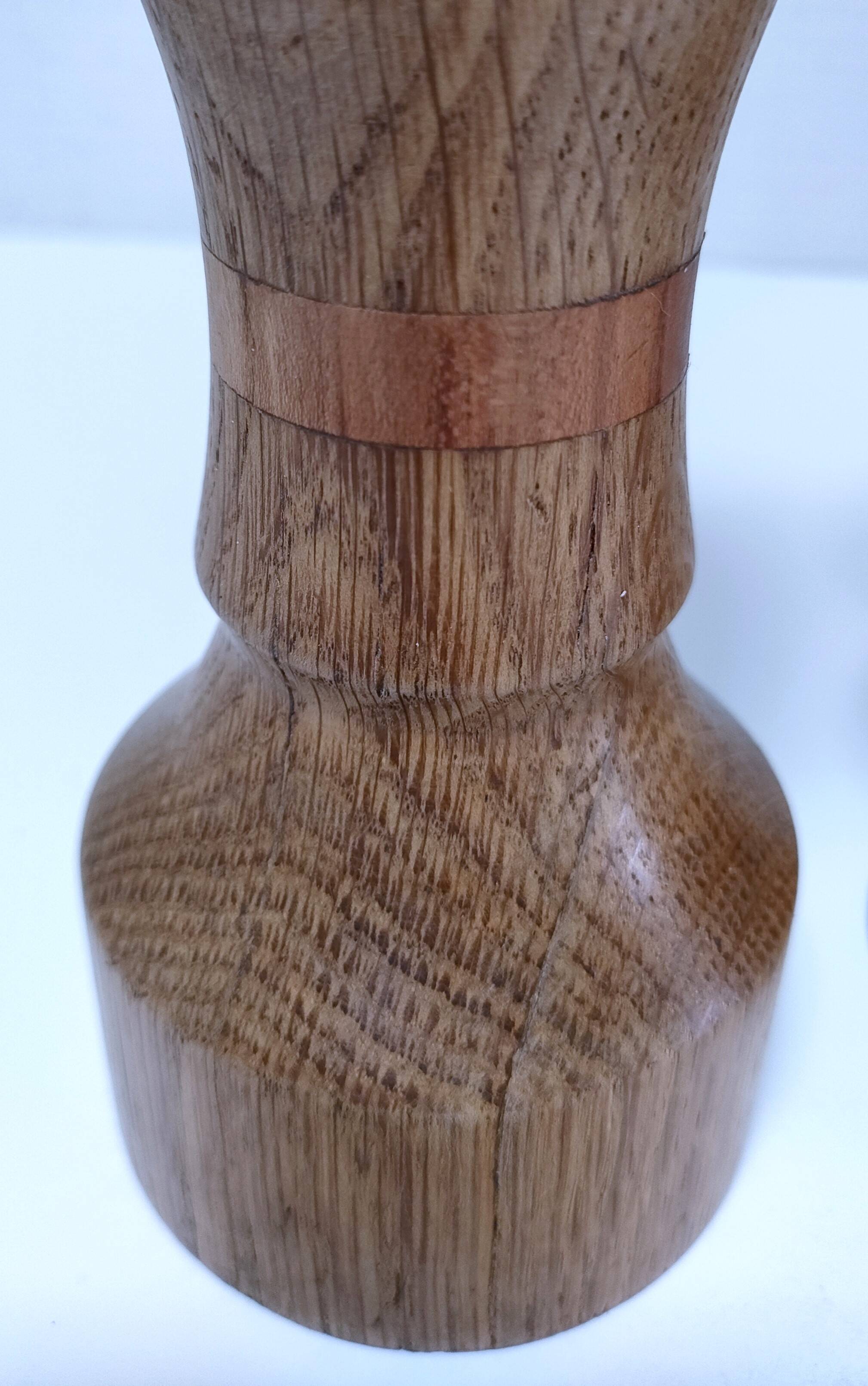 Three vintage patinated solid wood candlesticks