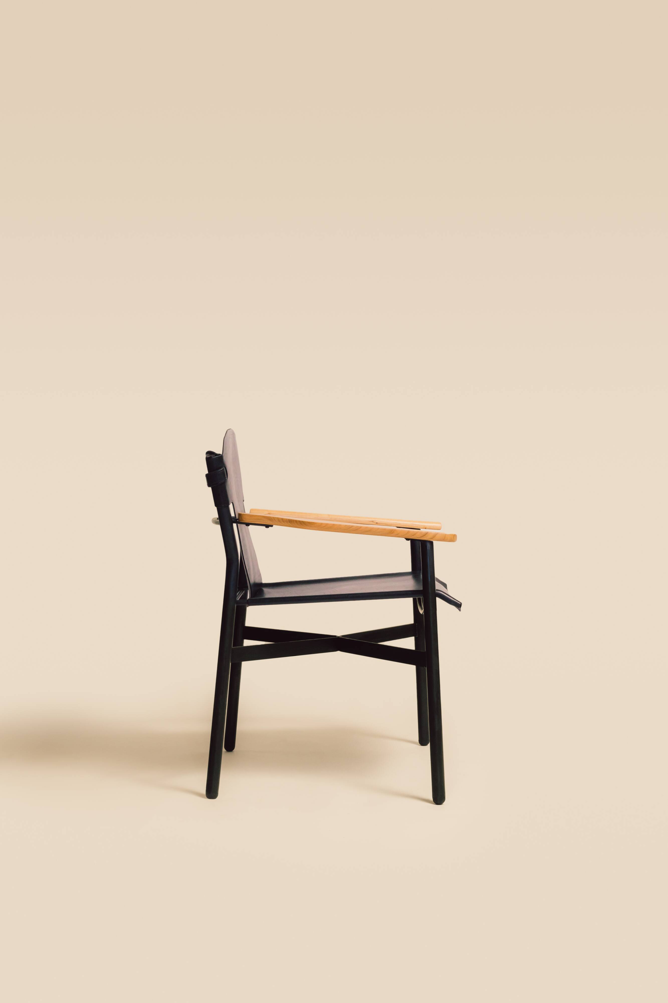 Maërl armchair, Galathée model, black leather, solid wood armrests of your choice