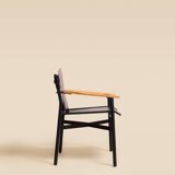 Maërl armchair, Galathée model, black leather, solid wood armrests of your choice