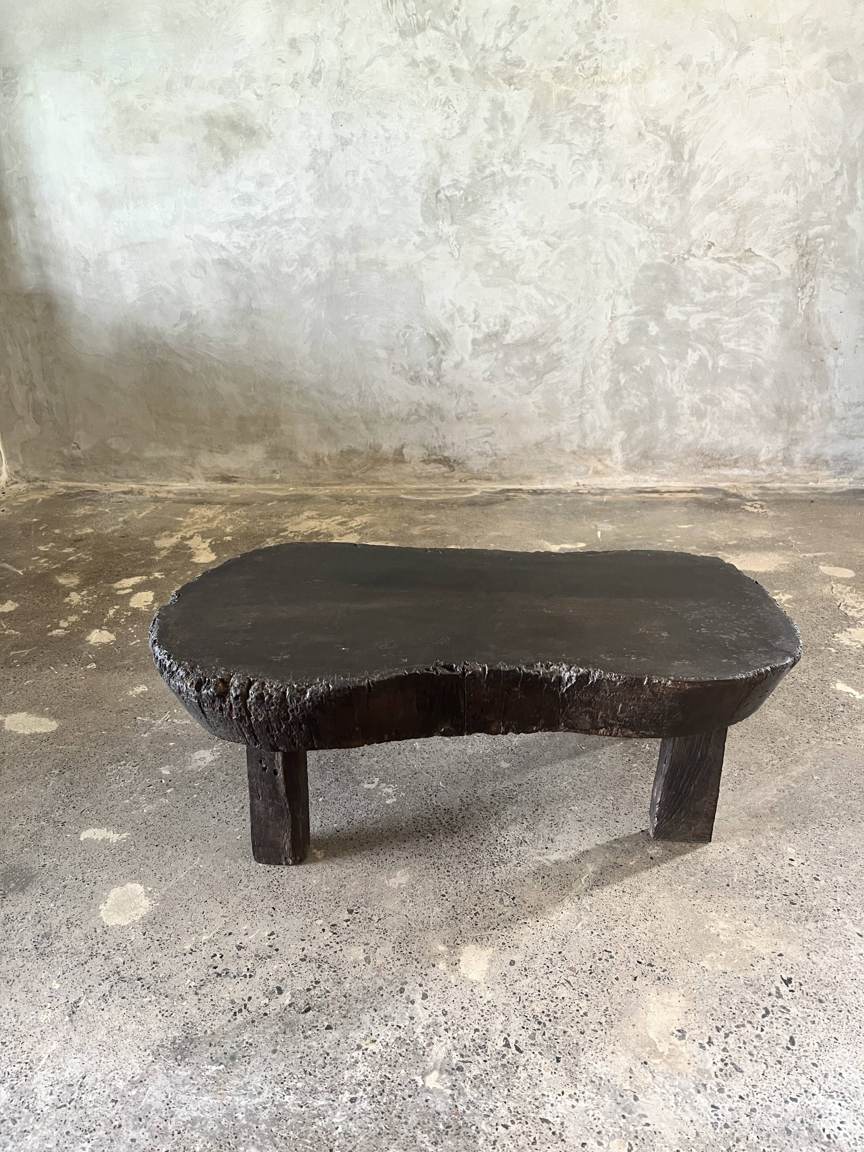 Small old Asian wooden coffee table in Japanese style, kidney-shaped top