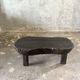 Small old Asian wooden coffee table in Japanese style, kidney-shaped top