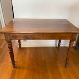 Walnut bistro table, feet turned.