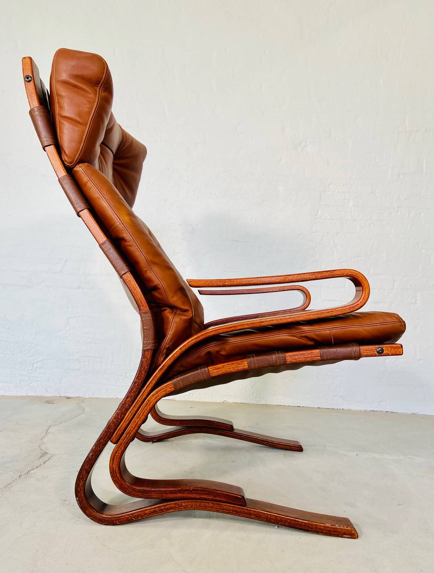 Vintage scandinavian cognac lounge chair by oddvin rykken 1960s