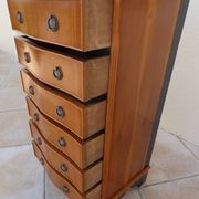Louis XVI style chest of drawers in wood and cherry veneer.
