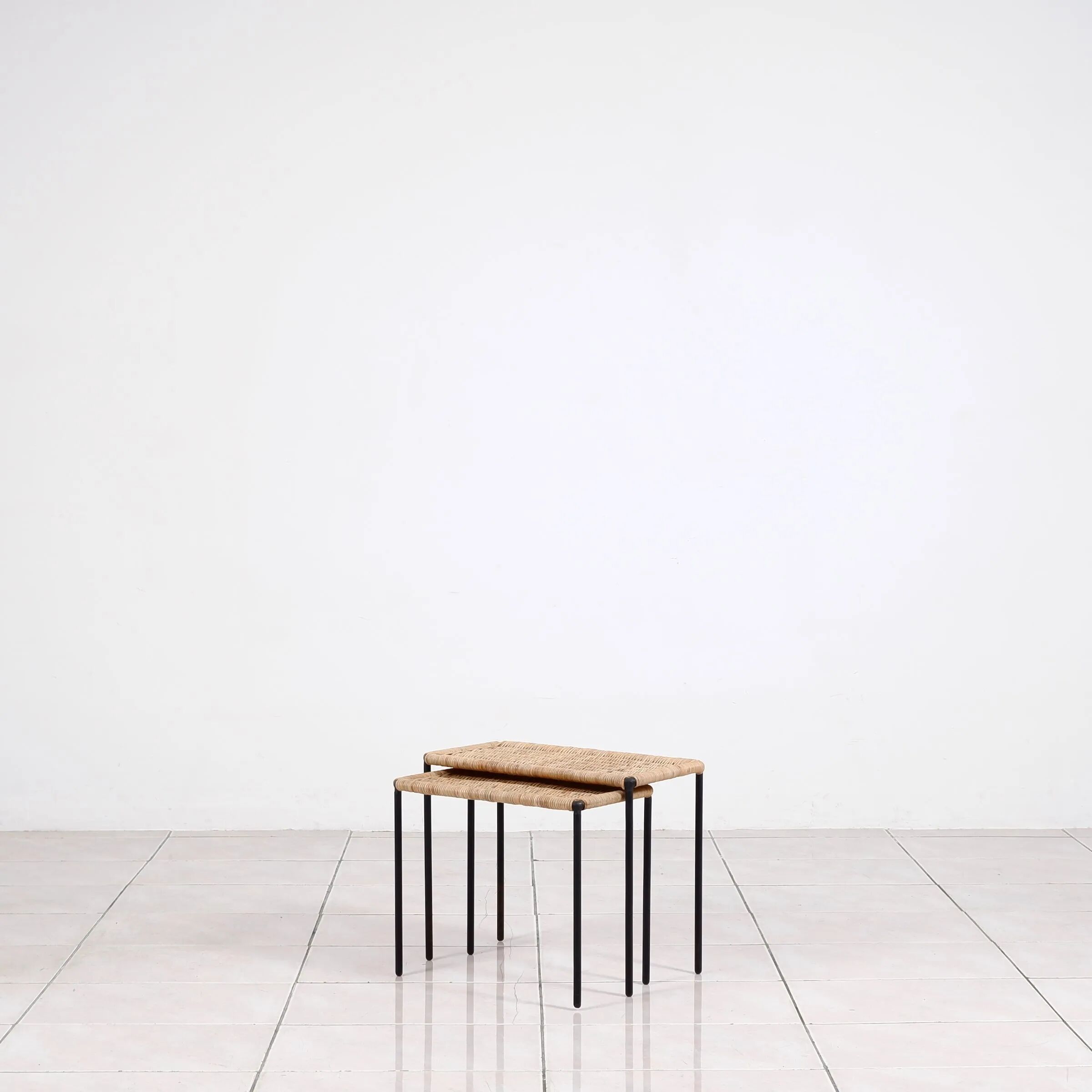 Nesting tables in metal / rattan by Carl Auböck