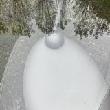 Naos designer coffee table in tempered glass and cast iron