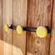 Vintage yellow metal wall coat rack