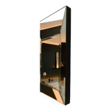 Asymmetrical beveled mirror