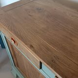 Buffet made of natural wood and bronze green.