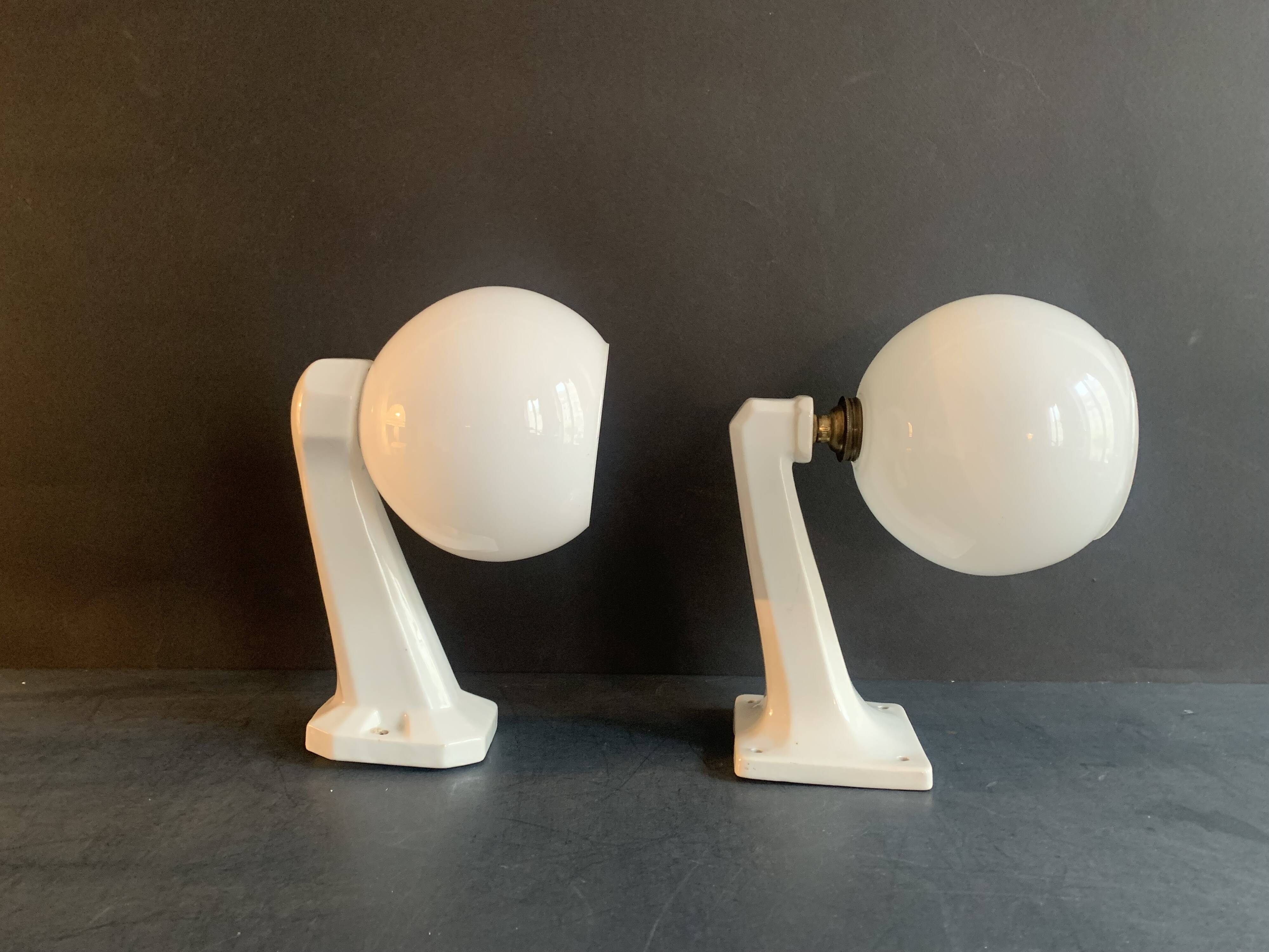 Pair of Art Deco porcelain wall lights with white Opaline globes, 1920