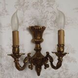 Pair of French baroque brass wall sconces with two branches, decorated with acanthus and wickerwork.