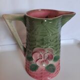 Slush pitcher. Pansy pattern on wicker basket background. Green and pink.