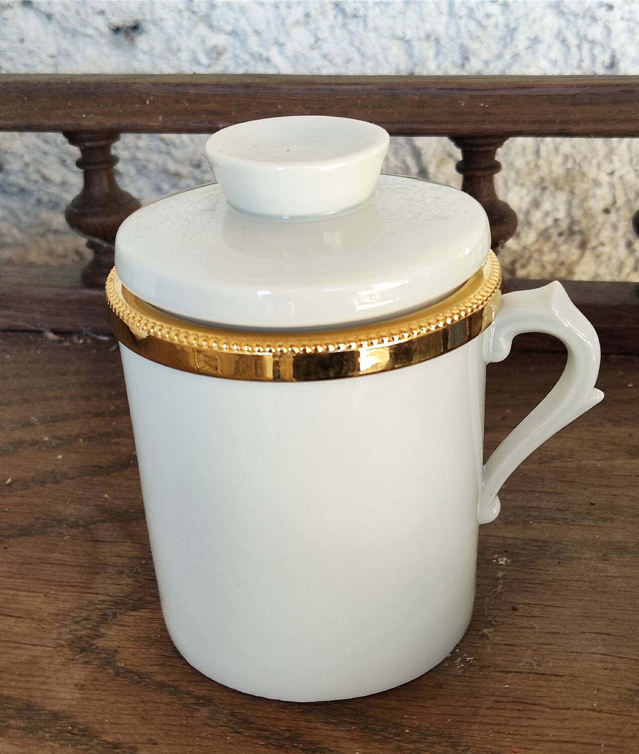 2 white and gold Limoges porcelain tea cups