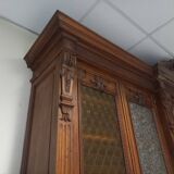Glass-fronted walnut bookcase