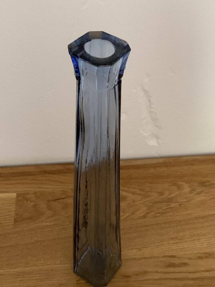 Translucent blue glass vase from the 1980s — tall prismatic silhouette, polygonal base.