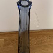 Translucent blue glass vase from the 1980s — tall prismatic silhouette, polygonal base.
