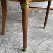 DeCoene antique wood writing desk with beige striped upholstered chair, brass-accented classic set