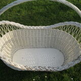 White wicker cradle basket