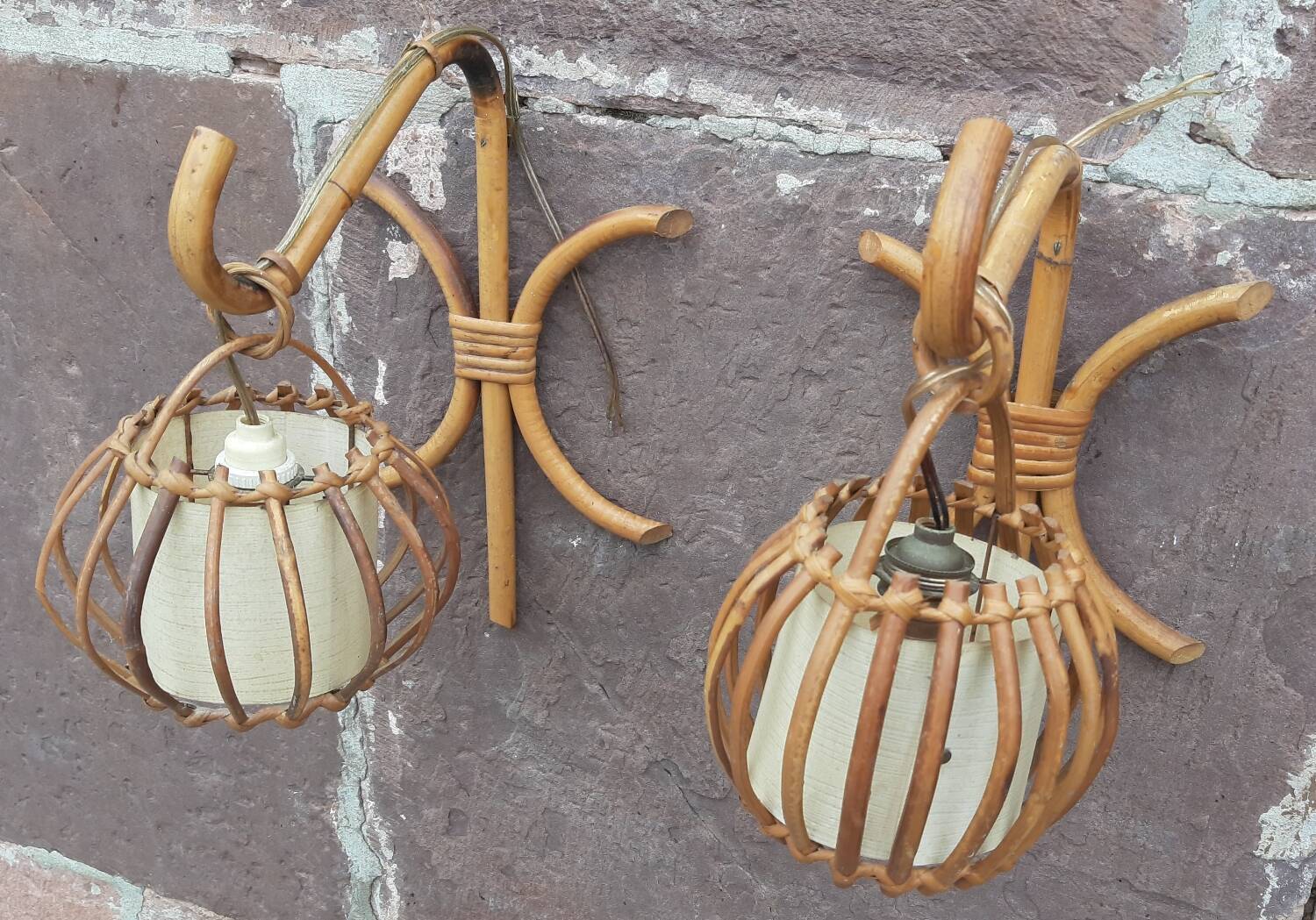 Pair of Louis Sognot rattan wall lights.