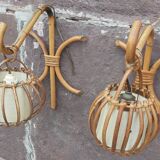 Pair of Louis Sognot rattan wall lights.