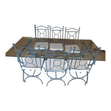 Wrought iron and bevelled glass table with 6 matching chairs.