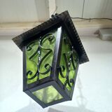 Wrought iron and green glass lantern